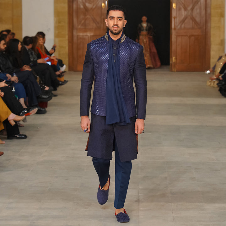 Blue leaf-design embroidered waistcoat paired with teal blue raw silk stole
