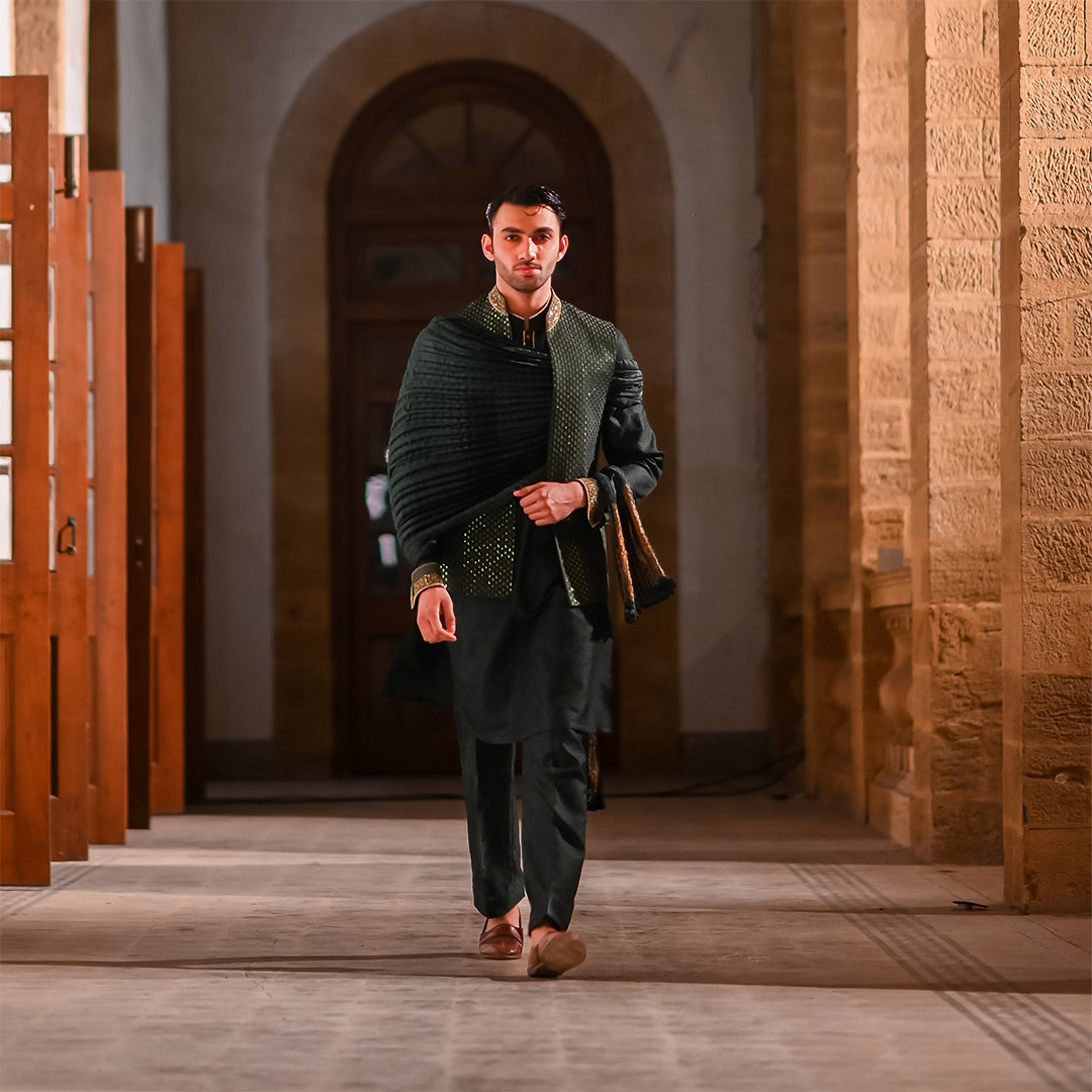 Green satin embroidered leaf-design waistcoat paired with jamawar kurta