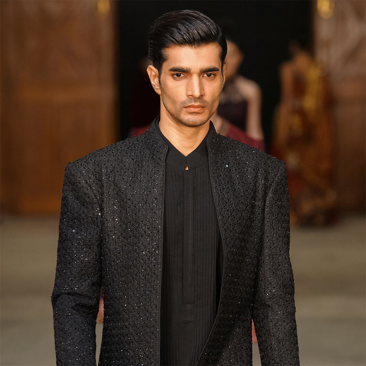 Black open-front sherwani in raw silk with cut-dana work