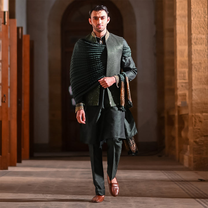 Green satin embroidered leaf-design waistcoat paired with jamawar kurta