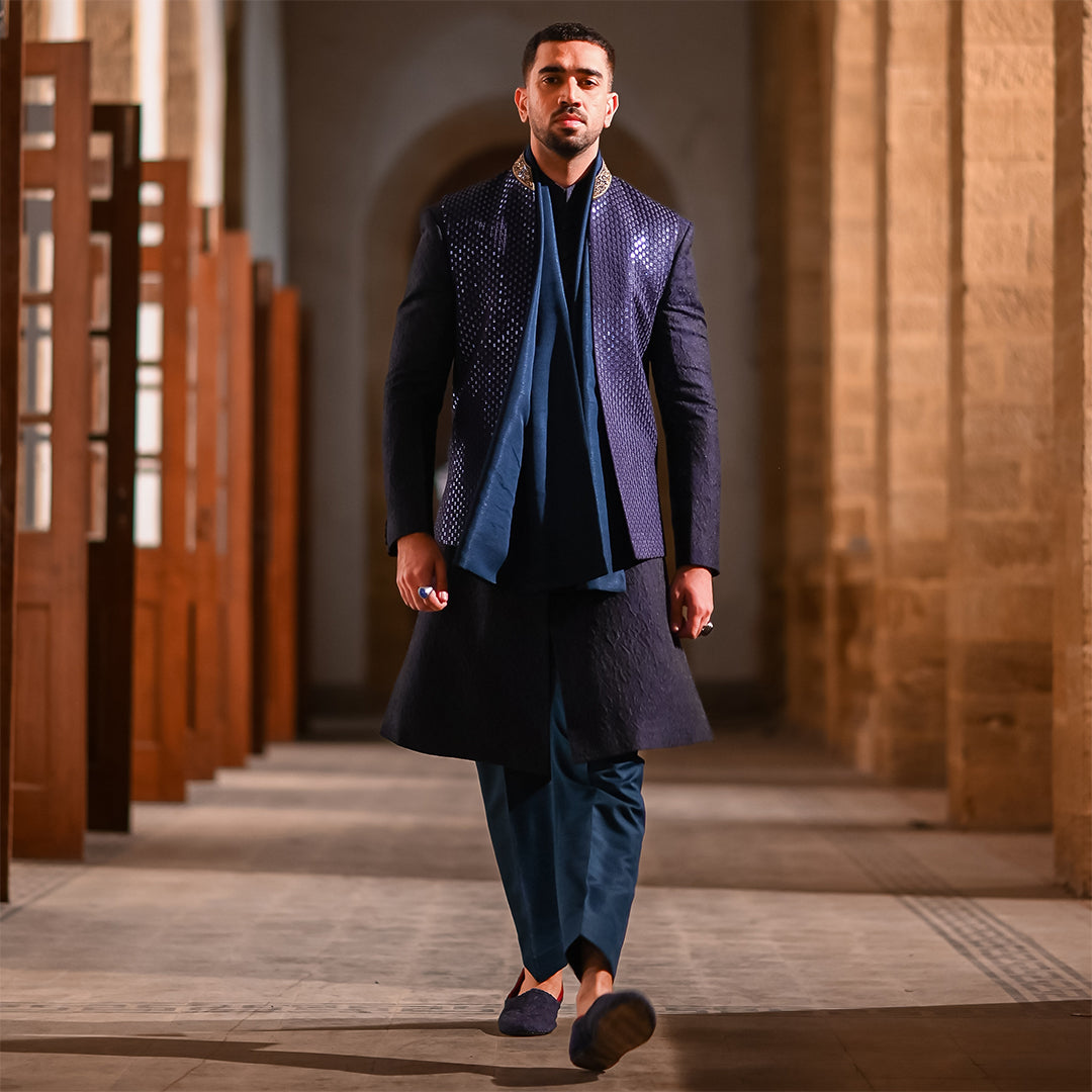 Blue leaf-design embroidered waistcoat paired with teal blue raw silk stole