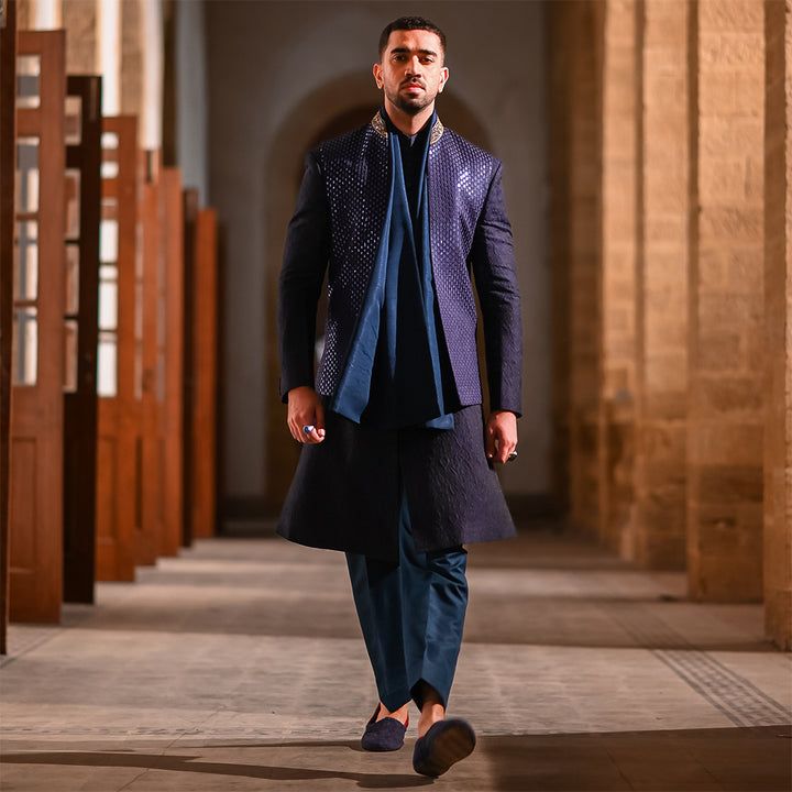 Blue leaf-design embroidered waistcoat paired with teal blue raw silk stole