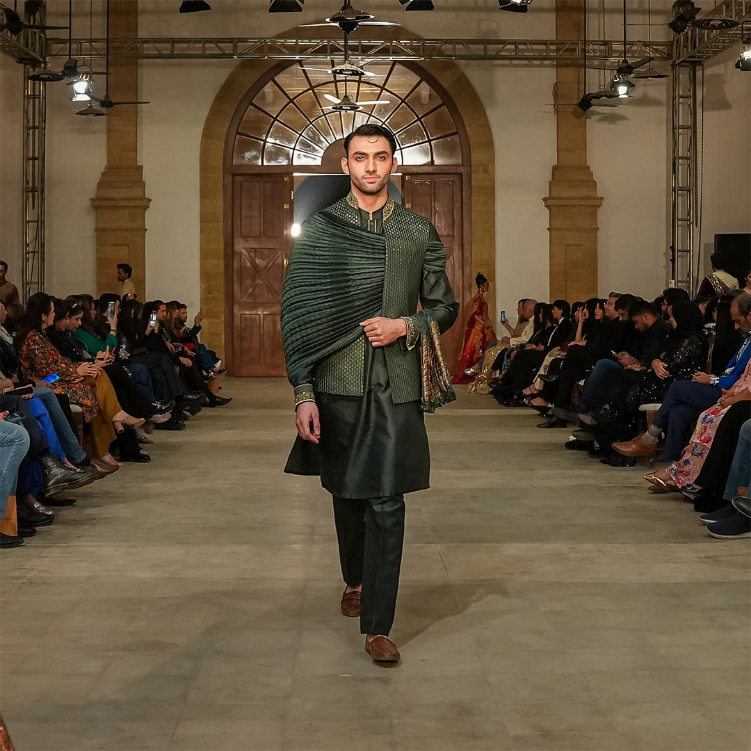 Green satin embroidered leaf-design waistcoat paired with jamawar kurta