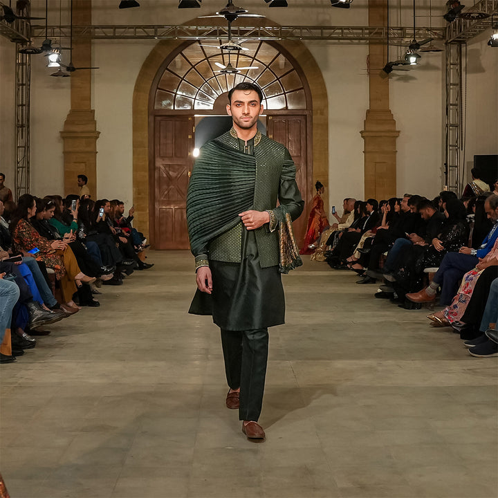Green satin embroidered leaf-design waistcoat paired with jamawar kurta