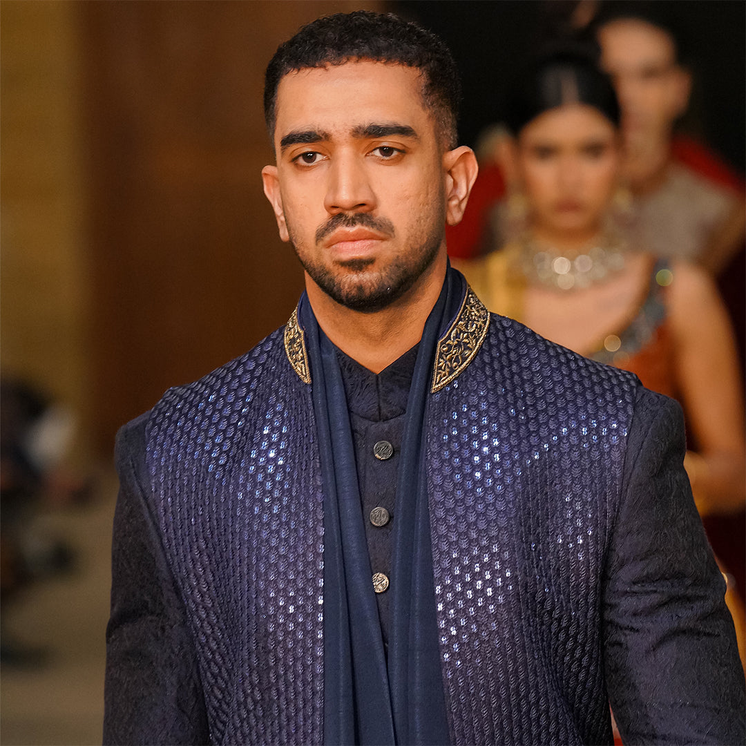 Blue leaf-design embroidered waistcoat paired with teal blue raw silk stole