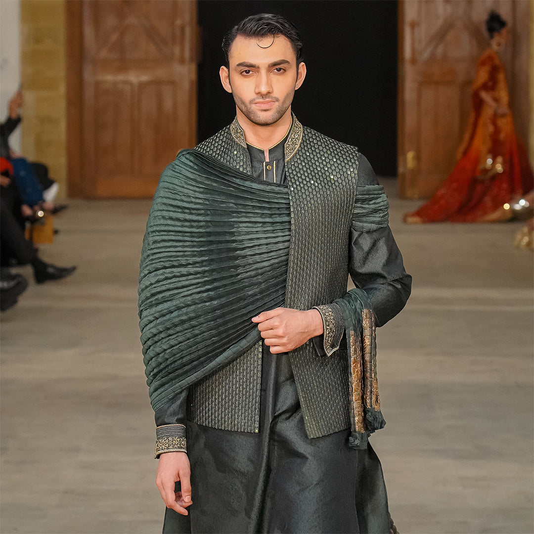 Green satin embroidered leaf-design waistcoat paired with jamawar kurta